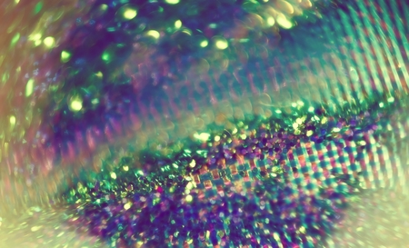 Extremely close up photo of glittering surface, abstract background.の写真素材