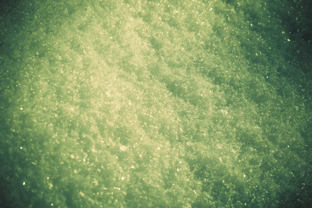 Close up image of snow texture, toned natural background.の写真素材
