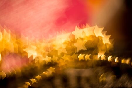 Colorful blurred background of pink and gold color, bokeh effects.の写真素材