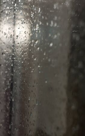 Water drops on window, macro photo with shallow focus.の写真素材