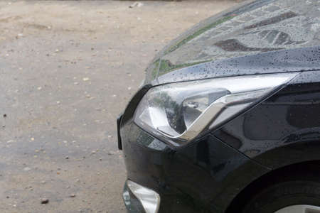Black car covered with water drops, close up background.の写真素材