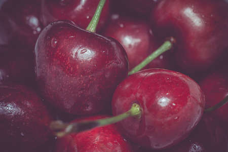 Fresh ripe cherry background, vintage photo effect.の写真素材