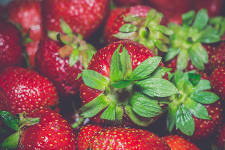 Fresh ripe strawberries background, vintage photo effect.の写真素材