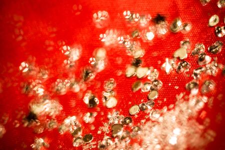 Big silver glitters on pink background, macro with shallow focus, bokeh effect.の写真素材