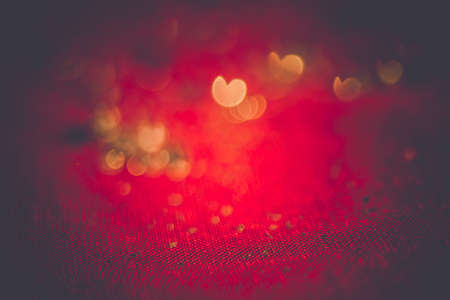 Big silver glitters on pink background, macro with shallow focus, bokeh with vintage effect.の写真素材