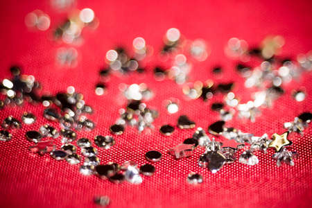 Big silver glitters on pink background, macro with shallow focus, bokeh effect.の写真素材