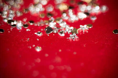 Big silver glitters on pink background, macro with shallow focus, bokeh effect.の写真素材