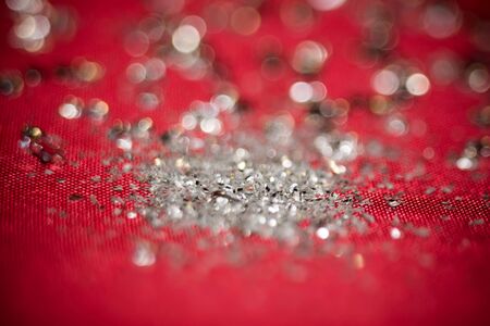Big silver glitters on pink background, macro with shallow focus, bokeh effect.の写真素材
