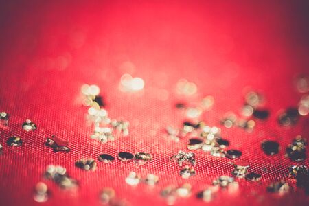 Big silver glitters on pink background, macro with shallow focus, bokeh with vintage effect.の写真素材