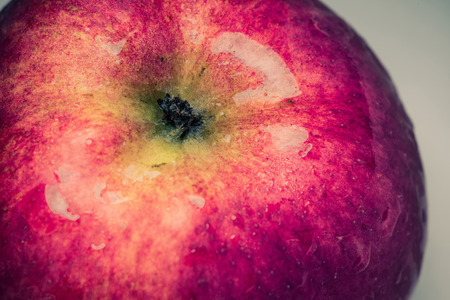 Tasty ripe red apple, close up background.の写真素材