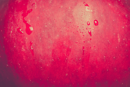 Tasty ripe red apple, close up background.の写真素材