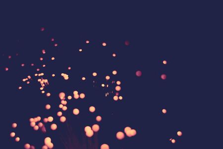 Defocused background with circular bokeh of red color.の写真素材