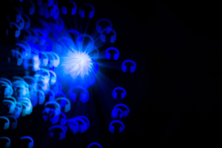 Defocused background with colorful bokeh in a shape of a headphonesの写真素材