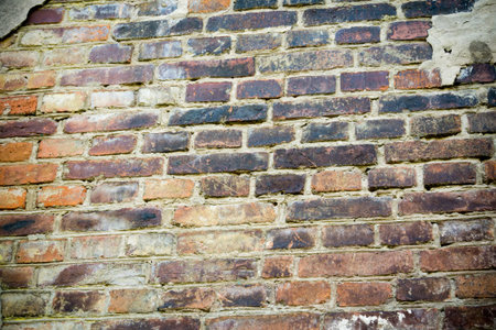 Old grunge brick wall texture as background.