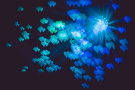 Defocused background with colorful bokeh in a shape of a heart.の写真素材