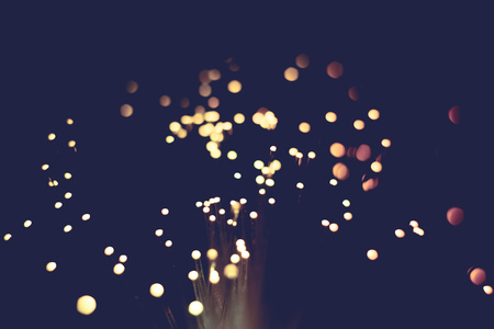 Defocused background with circular bokeh of red color.の写真素材