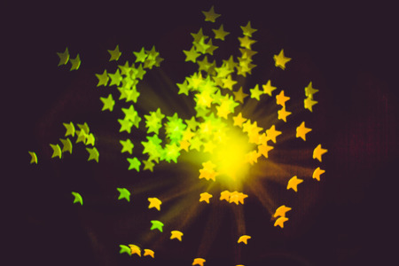 Defocused background with colorful bokeh in a shape of a star.の写真素材