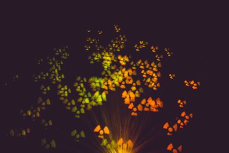 Defocused background with colorful bokeh lights effect.の写真素材