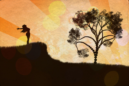 Stylized silhouette of a human relaxing on a beautiful sunset of a summer day.の写真素材