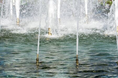 Classic fountain in city park close up photo.の写真素材
