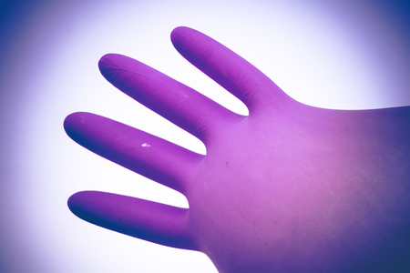 Colorful surgical glove inflated, air filled like a balloon.の写真素材