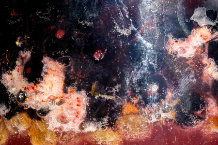 Fresh sweet berry jam in a glass jar, close up background.