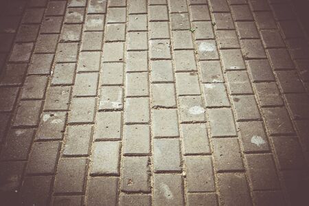Abstract background of an old park road made of bricks.の写真素材