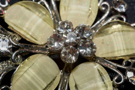 White pendant in a shape of a flower, made with glass and crystals macro.の写真素材