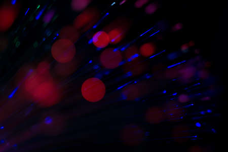 Bright colorful bokeh lights effect, defocused background.の写真素材
