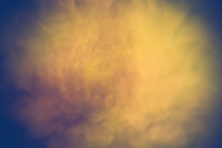 Blurred, defocused background of green and yellow color with bokeh effect.