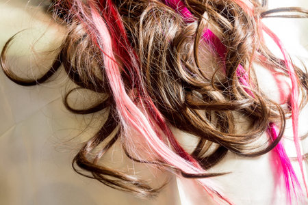 Brown synthetic curly hair close up background.の写真素材