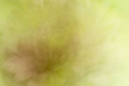 Blurred, defocused background of green and yellow color with bokeh effect.の写真素材