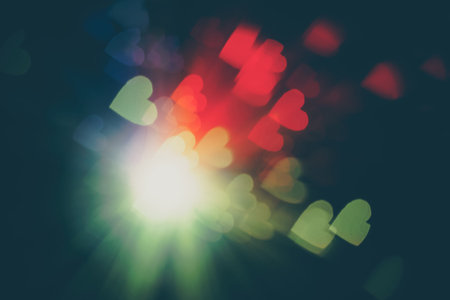 Bokeh in a shape of a heart defocused background.