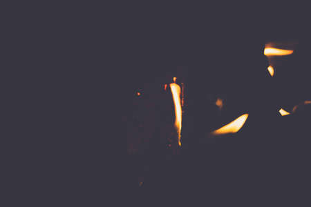 Soft focus of fire flames texture on a dark backgroundの写真素材