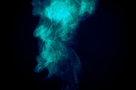 Abstract white smoke texture on a dark background, post processing.の写真素材