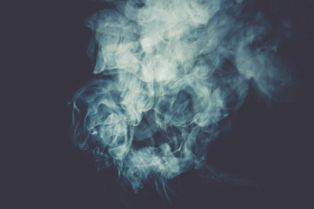 Abstract white smoke texture on a dark background, post processing.