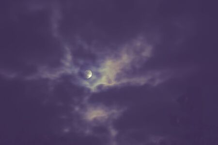 Photo of night cloudy sky and moon, defocused background. Not an illustration.の写真素材