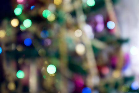 Festive background with bokeh from Christmas tree lights glowing.の写真素材