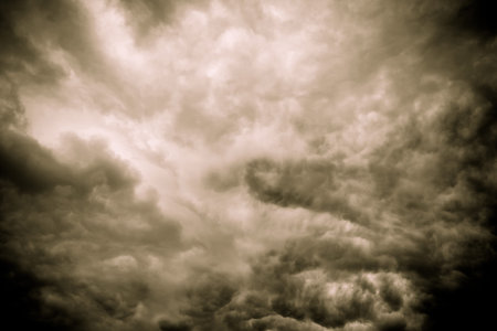 Dramatic stormy black sky clouds before rain, filtered background.
