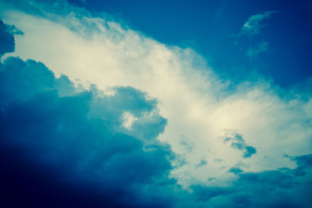 Dramatic stormy black sky clouds before rain, filtered natural background.