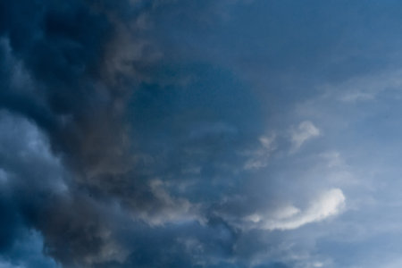 Dramatic stormy black sky clouds before rain, natural background.