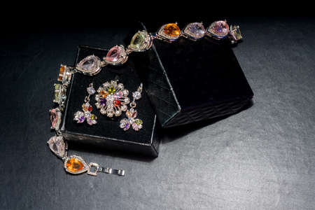 Silver bracelet and ring with decorated multicolored rhinestones, fashion jewellery.の写真素材