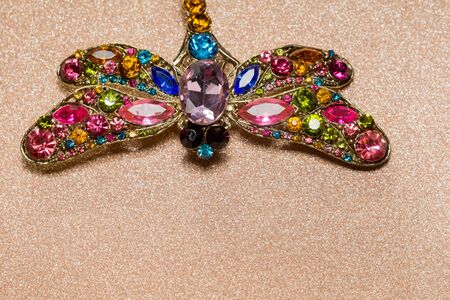 Brooch in a shape of a dragonfly decorated with multicolored rhinestones, fashion jewellery.の写真素材