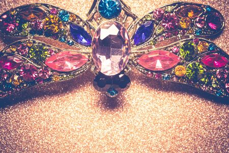 Brooch in a shape of a dragonfly decorated with multicolored rhinestones, fashion jewellery.の写真素材