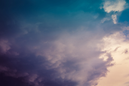Dramatic stormy dark sky clouds before rain, filtered natural background.の写真素材