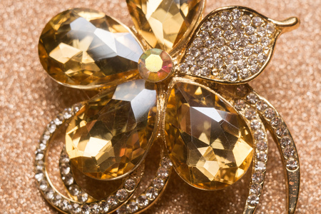 Brooch in a shape of a flower decorated with rhinestones, fashion jewellery.の写真素材