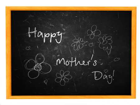 Illustration of Happy Mother's Day written on a black chalkboard.の写真素材