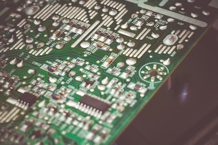 Green electric circuit board, close up background.の写真素材