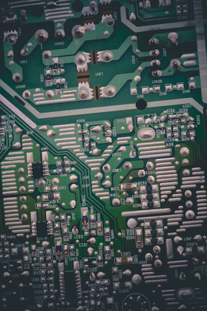 Green electric circuit board, close up background.の写真素材