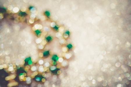 Elegant female jewelry golden bracelet with precious green gem, emerald, retro background.の写真素材